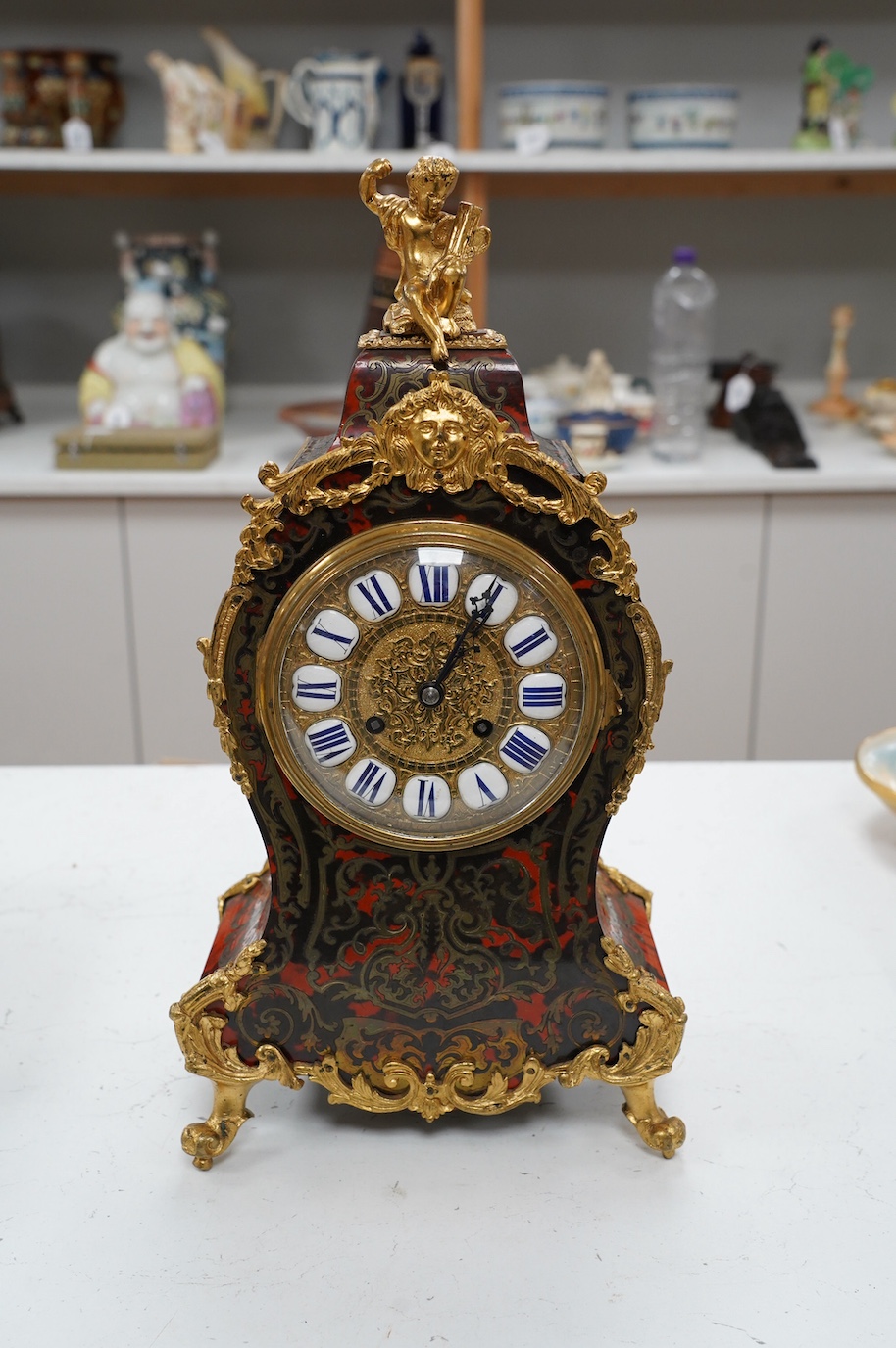 A late 19th century French boullework mantel clock, with key and pendulum, 40cm. Condition - fair to good, not tested as working